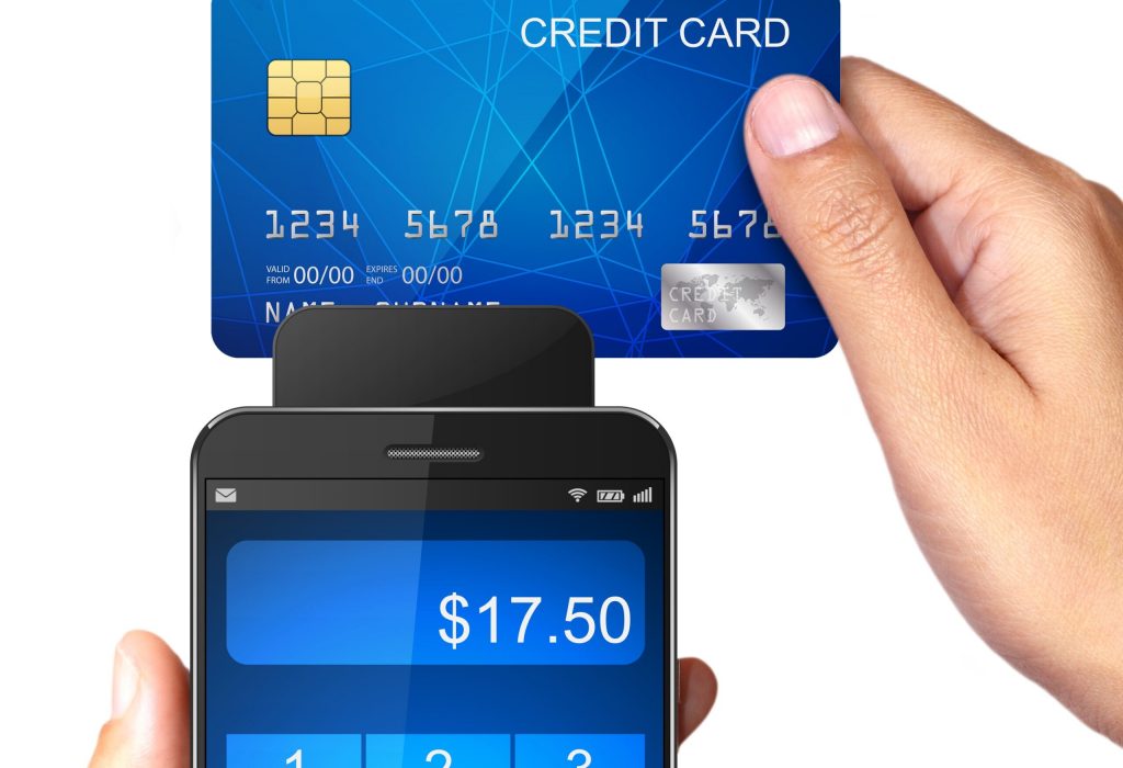 Hand,Holding,Smartphone,With,Processing,Of,Mobile,Payments,From,Credit